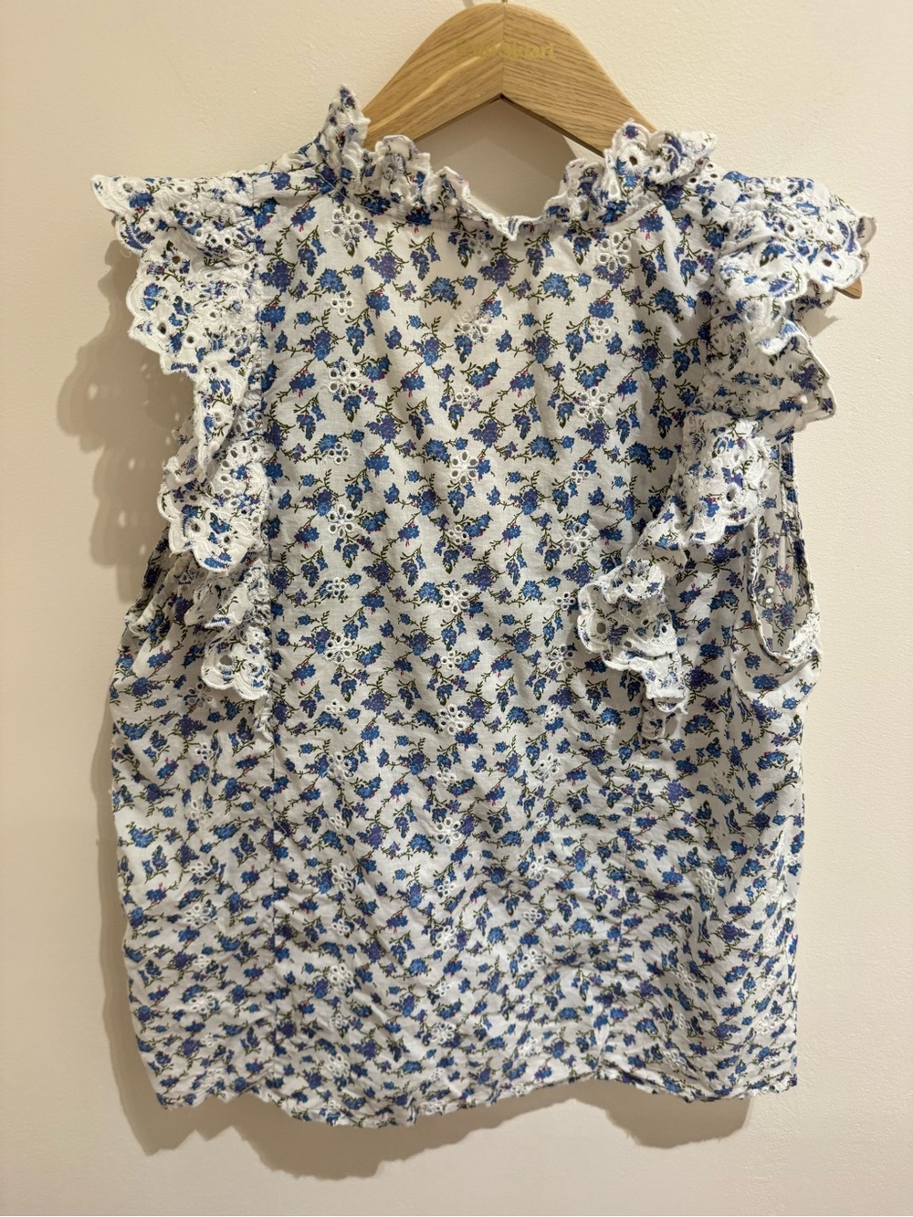 Ruffled V-Neck Sleeveless Blouse in Blue and White Floral - Picture 6 of 7